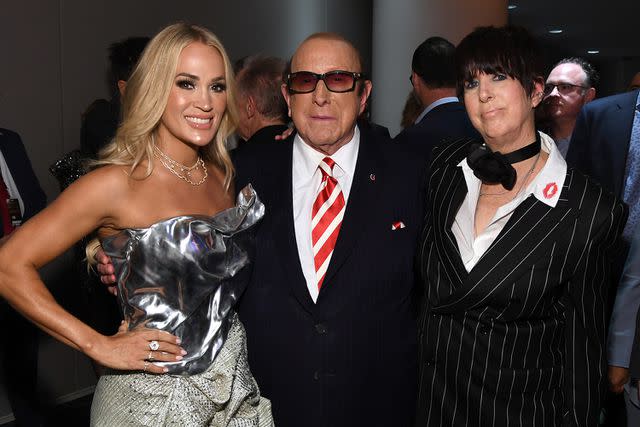 <p>L. Busacca/Getty</p> Carrie Underwood, Clive Davis and Diane Warren