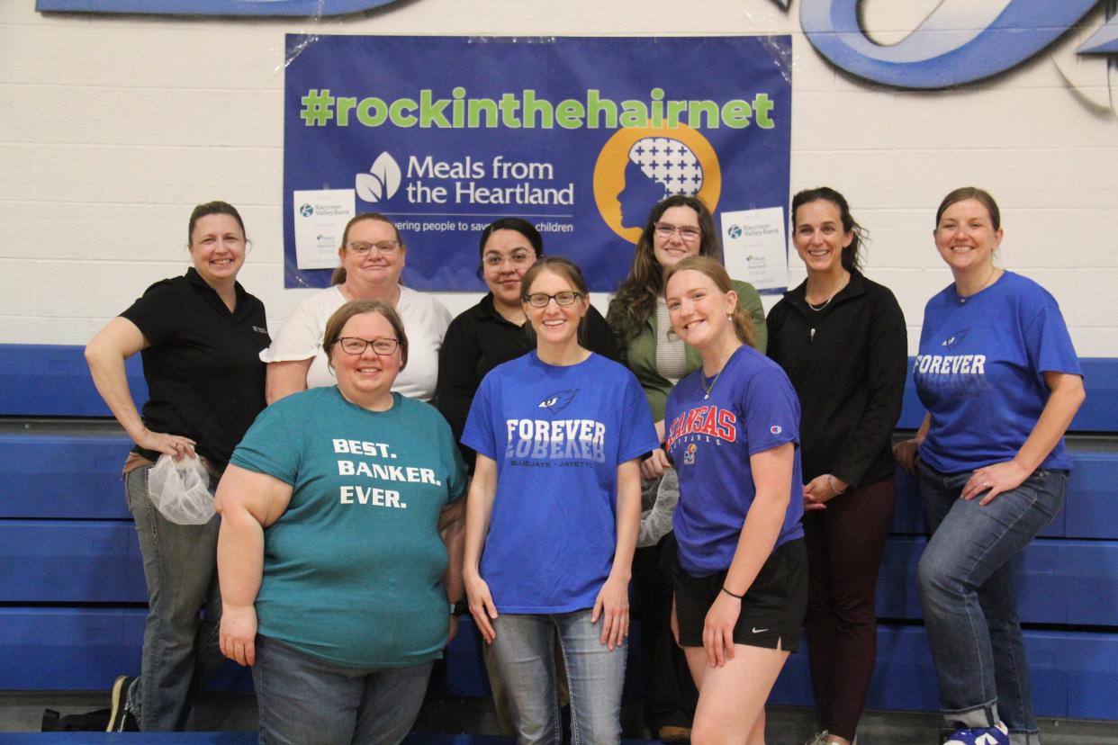 Raccoon Valley Bank employees pose for a photo during a Meals from the Heartland event on Thursday, May 9, 2024, at Perry Middle School. The bank sponsored the event and covered the cost of the meals.