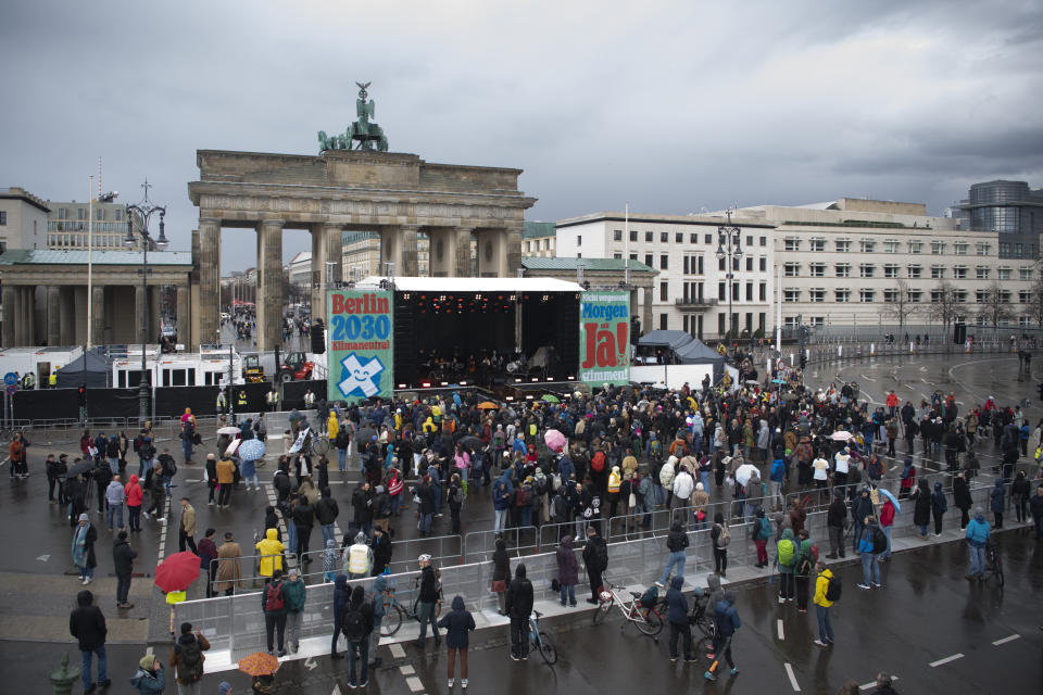 At the start of the "Berlin Climate Aid" concert, only a few people gathered at the Brandenburg Gate in Berlin Saturday, March 25, 2023. The organizers expects 35,000 participants. Voters in Berlin go to the polls this weekend to decide on a proposal that would force the city government to drastically ramp up the German capital’s climate goals. Sunday's referendum, which has attracted considerable financial support from U.S.-based philanthropists, calls for Berlin to become climate neutral by 2030. (Paul Zinken/dpa via AP)