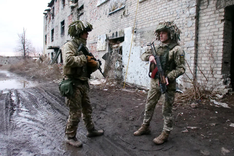 Ukrainian soldiers talk near a front-line position in Avdiivka, about 50 yards from pro-Russian separatists in Donetsk. (Gabe Joselow / NBC News)