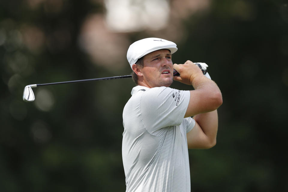 Bryson DeChambeau watches his drive on the 11th tee during the first round of the Rocket Mortgage Classic golf tournament, Thursday, July 2, 2020, at the Detroit Golf Club in Detroit. (AP Photo/Carlos Osorio)