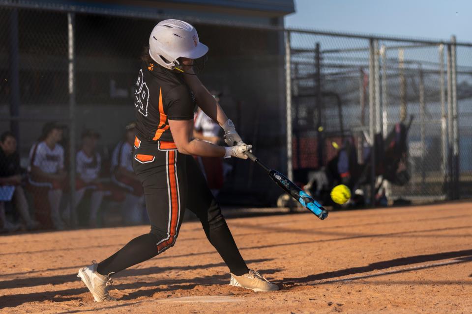 Catcher Aubrey Burbach (29) hits the ball during a game against Belvidere North on Monday, April 16, 2024, at Belvidere North High School.