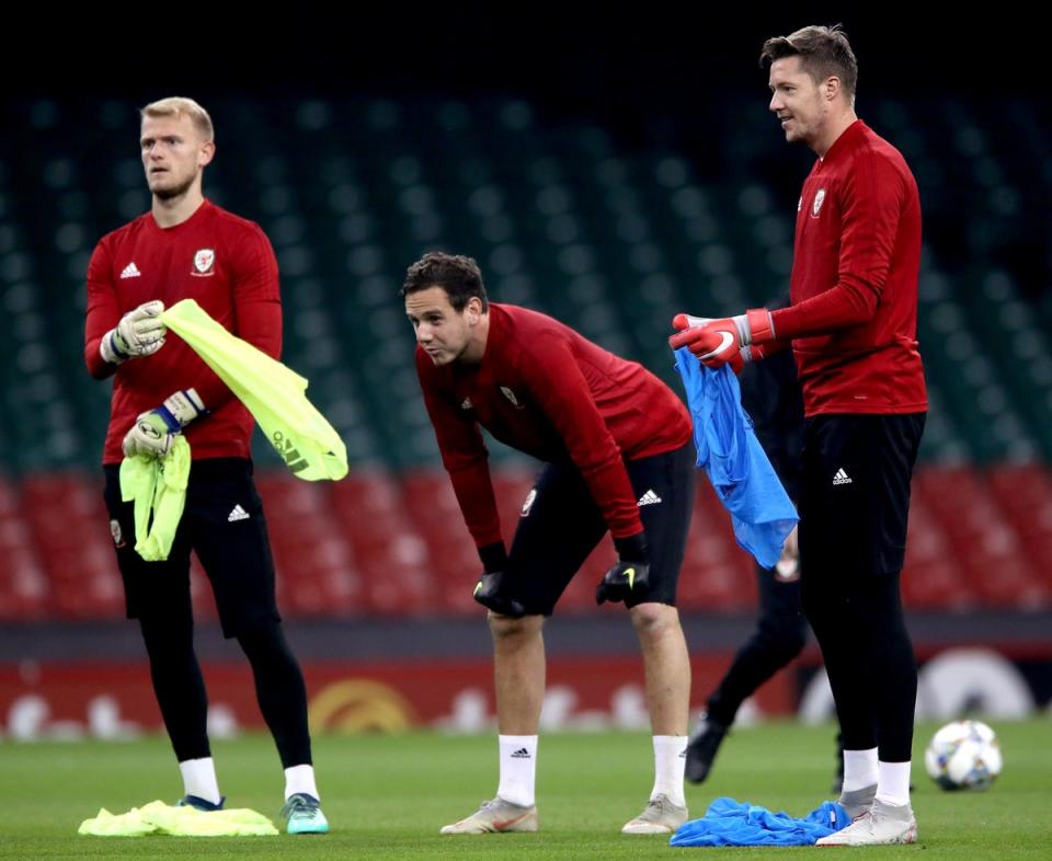 Wales’ third-choice goalkeeper Adam Davies, left, is on standby to start against Belgium with fitness doubts over Danny Ward, centre, and Wayne Hennessey, right, (Nick Potts/PA) (PA Archive)