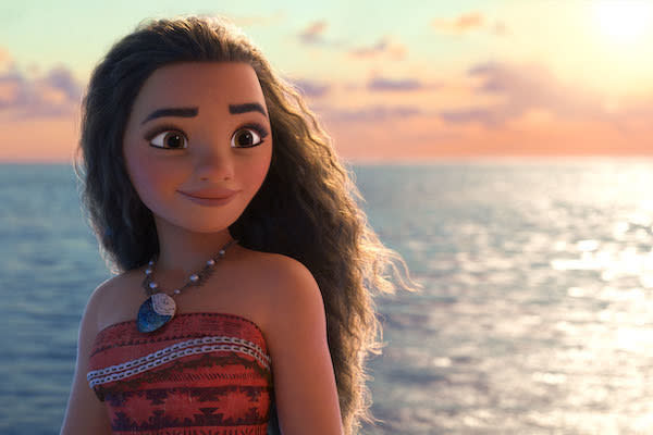 Moana (voiced by Auli'i Cravalho) happily looks into the distance