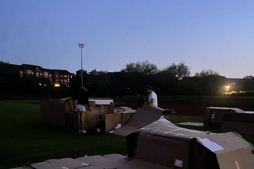 Darkness falls on Dam Park as the supporters settle in for the night