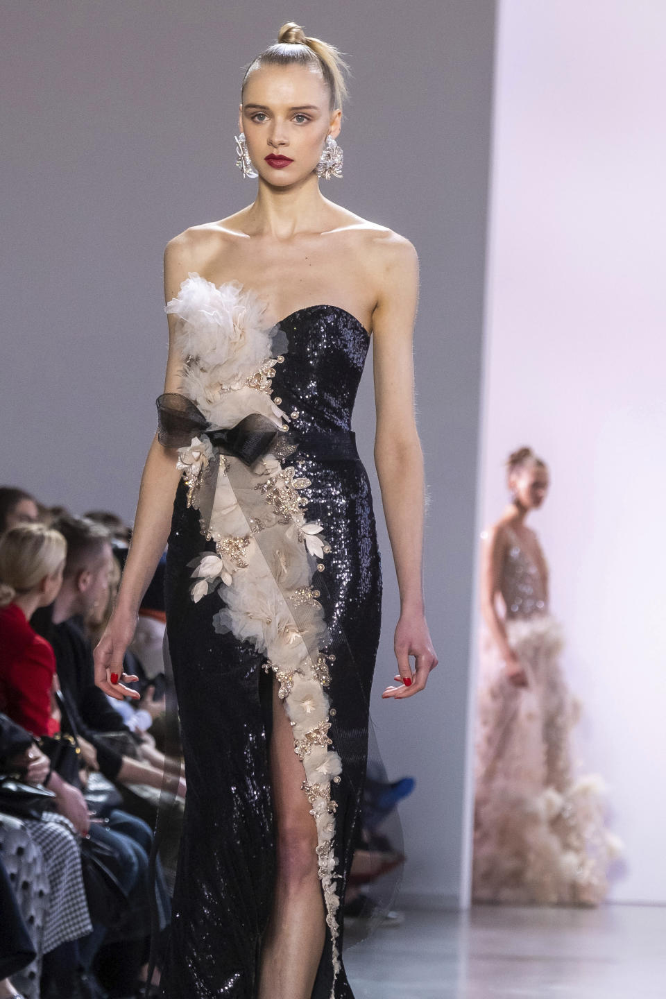 The Badgley Mischka collection is modeled at Spring Studios during NYFW Fall/Winter 2020 on Saturday, Feb. 8, 2020, in New York. (Photo by Charles Sykes/Invision/AP)