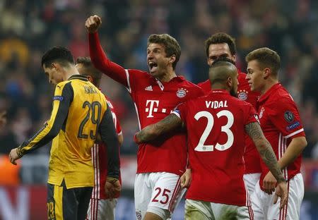 Football Soccer - Bayern Munich v Arsenal - UEFA Champions League Round of 16 First Leg - Allianz Arena, Munich, Germany - 15/2/17 Bayern Munich's Thomas Muller celebrates scoring their fifth goal with teammates Reuters / Michaela Rehle Livepic