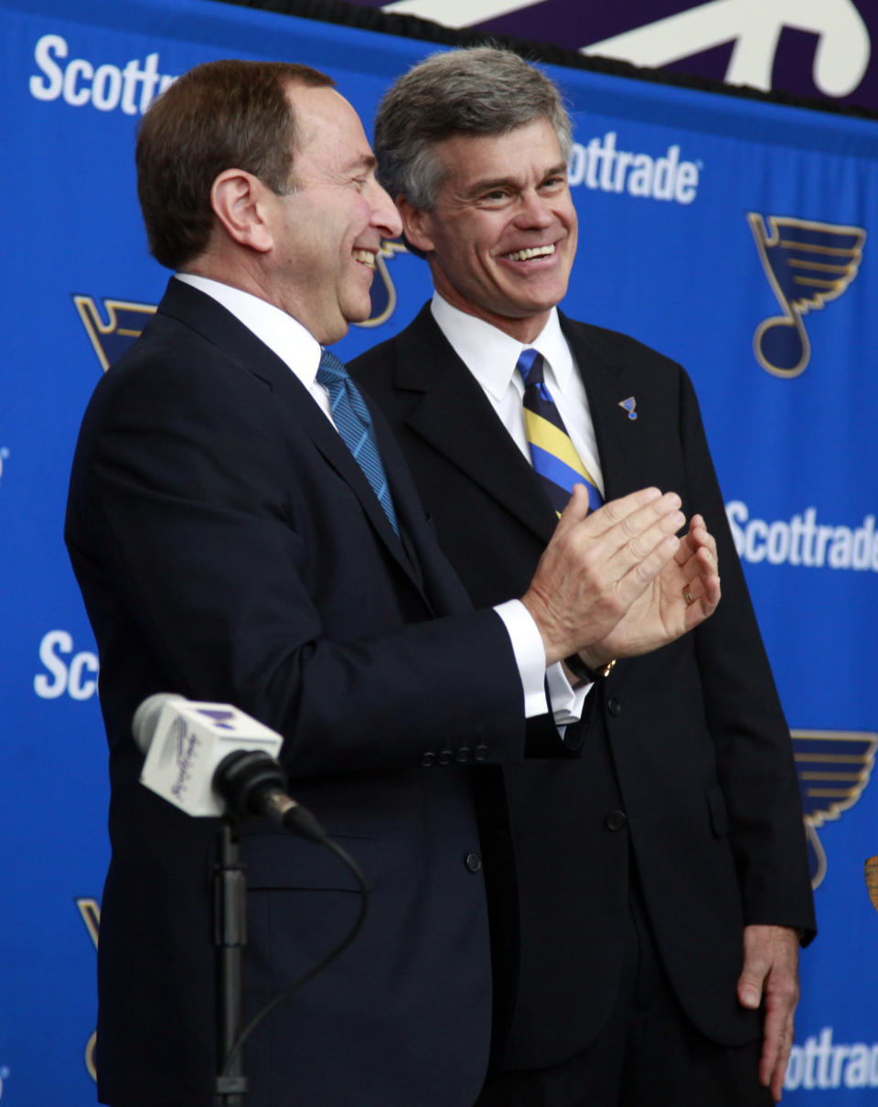 Tom Stillman, right, smiles as NHL commissioner Gary Bettman applauds during a news conference announcing the sale of the St. Louis Blues hockey team to a group headed by Stillman Thursday, May 10, 2012, in St. Louis. Stillman becomes the eighth owner of the Blues since the franchise started in 1966. (AP Photo/Jeff Roberson)