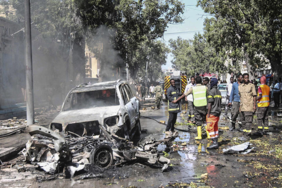 <p>Firefighters gather at the scene of a suicide car bomb attack in Mogadishu, Somalia, Oct. 1, 2016. Reports say that a suicide car bomb rammed into a popular restaurant near the presidential palace in the capital Mogadishu, killing at least two people. There is no claim of responsibility yet but the country’s Islamist militant group al-Shabab often carries out similar attacks in Mogadishu. (Photo: SAID YUSUF WARSAME/EPA)</p>