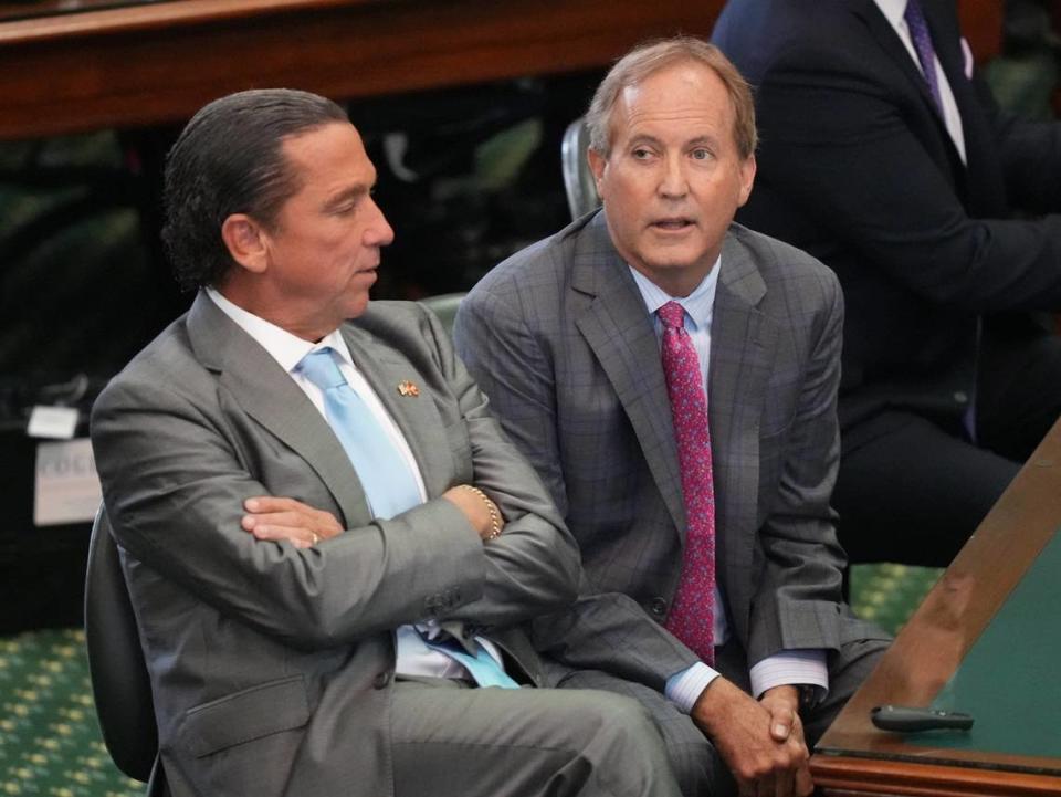 Attorney General Ken Paxton, right, waits with his attorney Tony Buzbee for closing arguments to begin at his impeachment trial at the Capitol on Friday September 15, 2023.