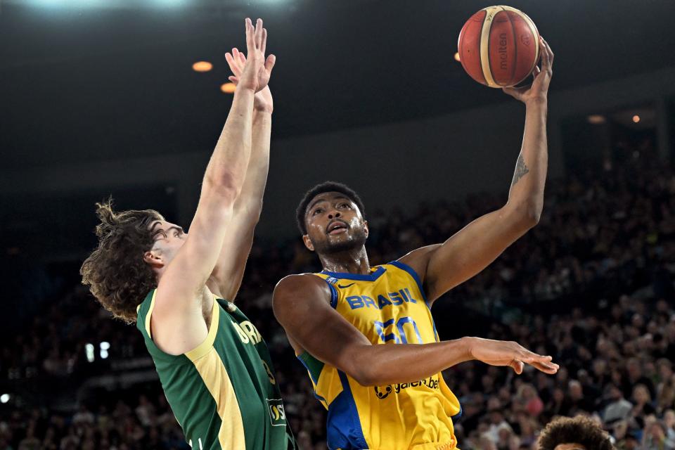 Brazil’s Bruno Caboclo (R) lays up as Australia’s Josh Giddey (L) attempts to block during the international friendly basketball match between Australia and Brazil in Melbourne on August 16, 2023, in preparation for the 2023 Philippines-Japan-Indonesia FIBA Basketball World Cup. (Photo by William WEST / AFP) / –IMAGE RESTRICTED TO EDITORIAL USE – STRICTLY NO COMMERCIAL USE– (Photo by WILLIAM WEST/AFP via Getty Images)