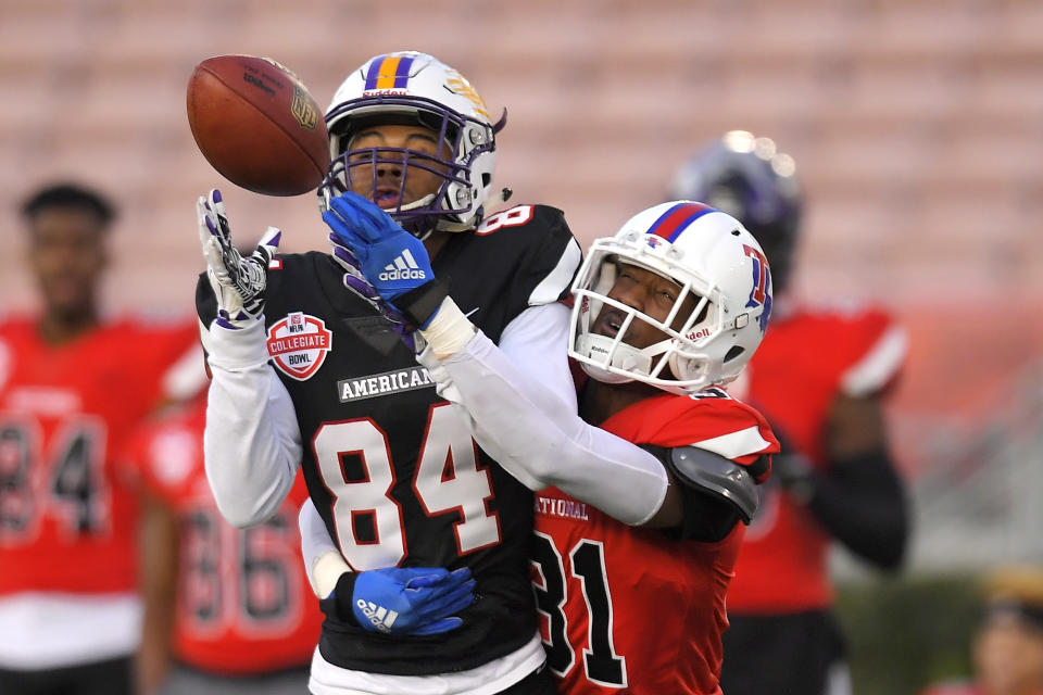 American Team wide receiver Juwan Green, left, of Albany, attempts a catch only to have it broken up by National Team cornerback L'Jarius Sneed, of Louisiana Tech, during the first half of the Collegiate Bowl college football game Saturday, Jan. 18, 2020, in Pasadena, Calif. (AP Photo/Mark J. Terrill)