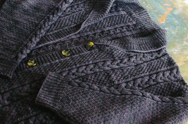 <p>A finished sweater knit by Brother Aidan. Photo: Whitney Bauck/Fashionista</p>
