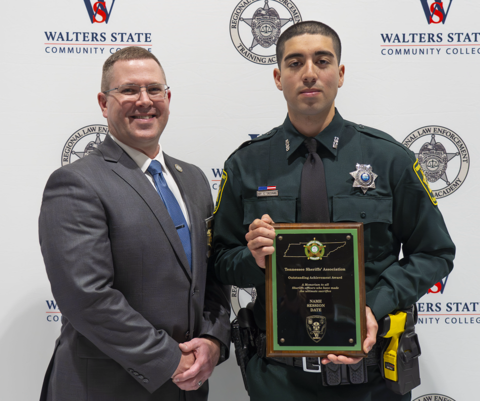 Cesar Saldivar of the Robertson County Sheriff’s Office, right, pictured with Walters State Regional Law Enforcement Academy Director Travis Stansill.