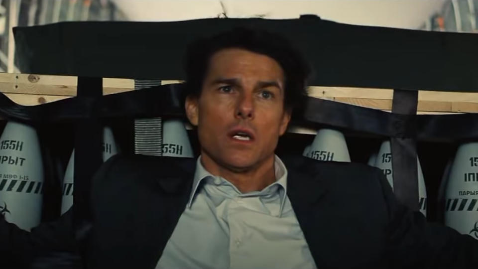 Tom Cruise up against a pallet of bombs in Mission: Impossible - Rogue Nation.