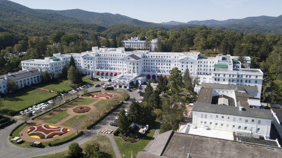 FILE - This is a Sept. 15, 2019, file photo showing The Greenbrier resort nestled in the mountains in White Sulphur Springs, W.Va. The West Virginia stop on the PGA Tour has fallen victim to the coronavirus pandemic and a schedule change to the fall. The PGA Tour and The Greenbrier resort announced Thursday, April 16, 2020, that A Military Tribute at The Greenbrier, scheduled for Sept. 10-13, has been canceled to make room for other tournaments that had been called off due to the virus. Both parties also announced that the remaining years of the tournament’s contract through 2026 have been canceled. (AP Photo/Steve Helber, File)