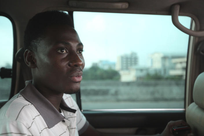 FILE - In this Wednesday, Nov. 17, 2011 file photo, Rashidi Williams, a gay man, rides in a car in Lagos, Nigeria. Local and international groups fighting AIDS warned on Tuesday, Jan. 14, 2014, that a new Nigerian law criminalizing same-sex marriage and gay organizations will jeopardize the fight against the deadly disease. Human rights activists reported that dozens of gay men were being arrested in northern Nigeria in an apparent response to the law. (AP Photo/Sunday Alamba, File)