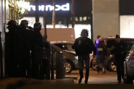 Police conduct an investigation near the Champs Elysees Avenue after a shooting incident in Paris, France, April 20, 2017. REUTERS/Christian Hartmann