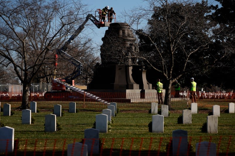 ARLINGTON, VIRGINIA – DECEMBER 20: Contractors work to dismantle and remove the Confederate Memorial in Section 16 at Arlington National Cemetery on December 20, 2023 in Arlington, Virginia. The U.S. Naming Commission recommended that the Confederate Memorial be removed from the cemetery and relocated to to the New Market Battlefield State Historical Park. Unveiled in 1914, 44 years after the end of the American Civil War, the memorial commemorates members of the armed forces of the Confederate States of America who died during the war. 482 of whom, along with some of their spouses, are buried in a circle around the memorial. (Photo by Chip Somodevilla/Getty Images)