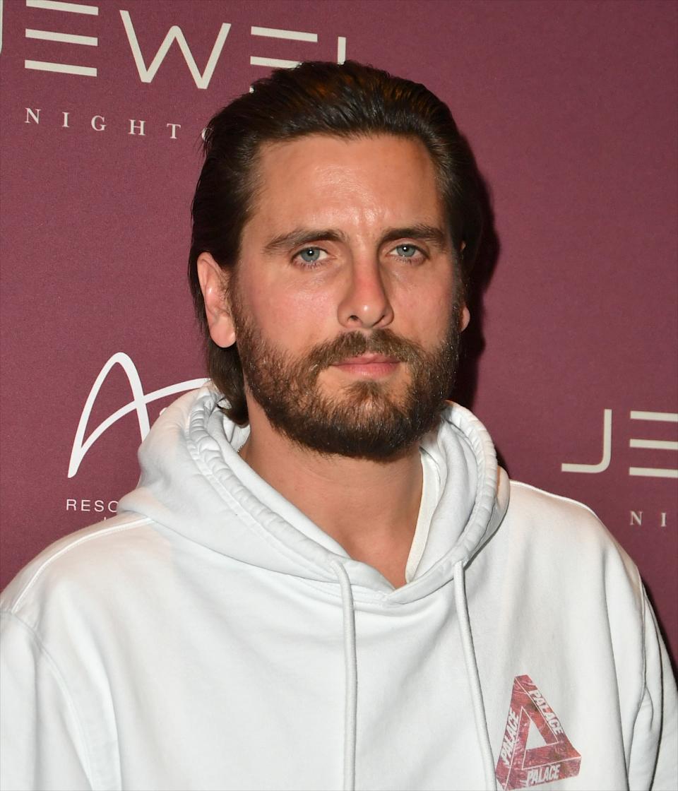 Close-up of Scott at a media event wearing a hoodie