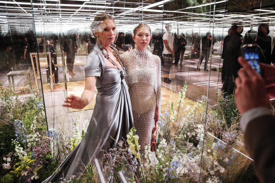 FILE - In this Jan. 27, 2021 file photo, model Kate Moss, left, and her daughter Lila Grace Moss wear a creation for Fendi's Spring-Summer 2021 Haute Couture fashion collection presented in Paris. The pandemic has torn a multibillion-dollar bite out of the fabric of Europe's luxury industry, stopped runway shows and forced brands to show their designs digitally instead. Now, amid hopes of a return to near-normality by the year’s end, the industry is asking what fashion will look like as it dusts itself and struggles to its well-heeled feet again. (AP Photo/Francois Mori, File)