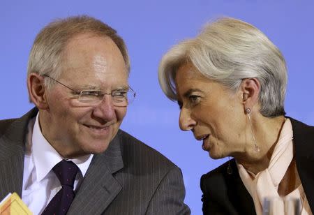 German Finance Minister Wolfgang Schaeuble (L) talks with France's Economy Minister Christine Lagarde during a news conference in Berlin in this February 11, 2011 file photo. REUTERS/Thomas Peter/Files