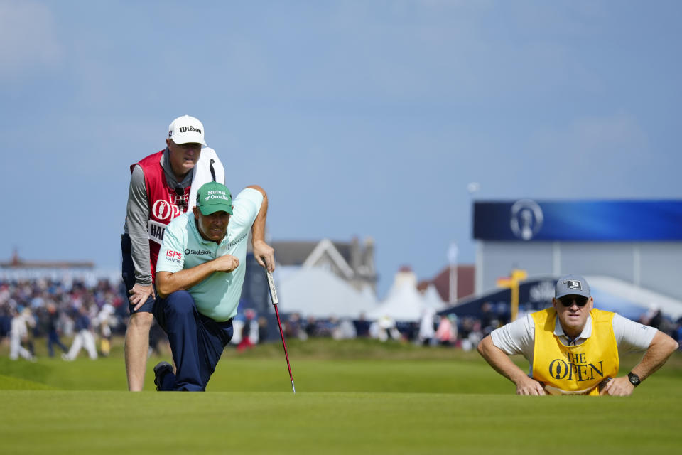 Ireland's Padraig Harrington looks at the line of his putt on the 4th green on the first day of the British Open Golf Championships at the Royal Liverpool Golf Club in Hoylake, England, Thursday, July 20, 2023. (AP Photo/Jon Super)