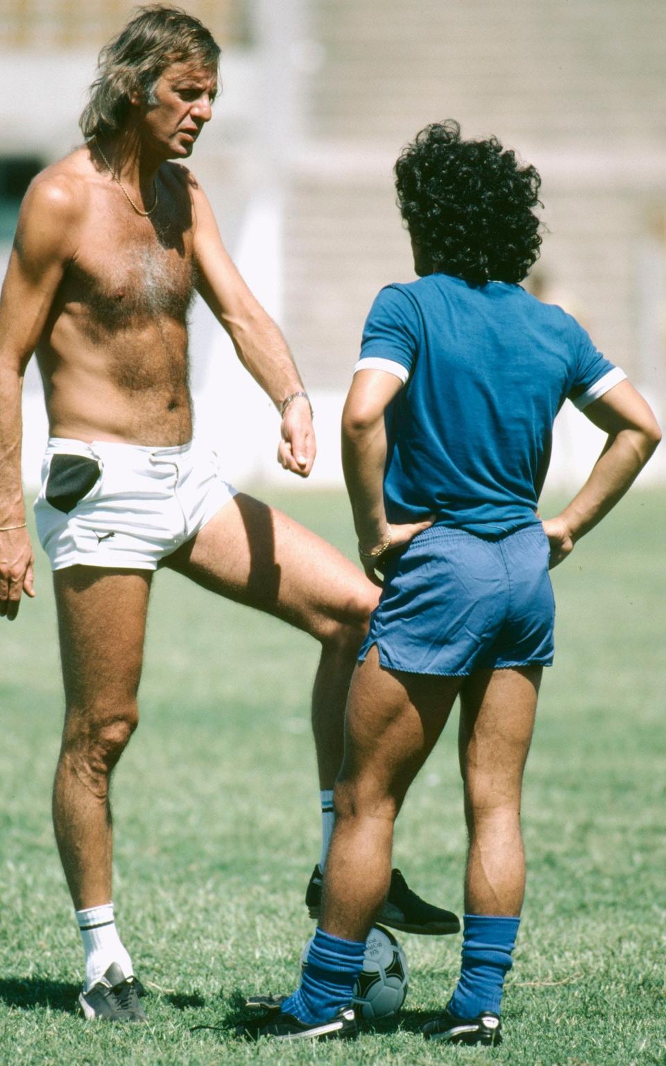 César Menotti, left, talking with his rising star Diego Maradona in 1980