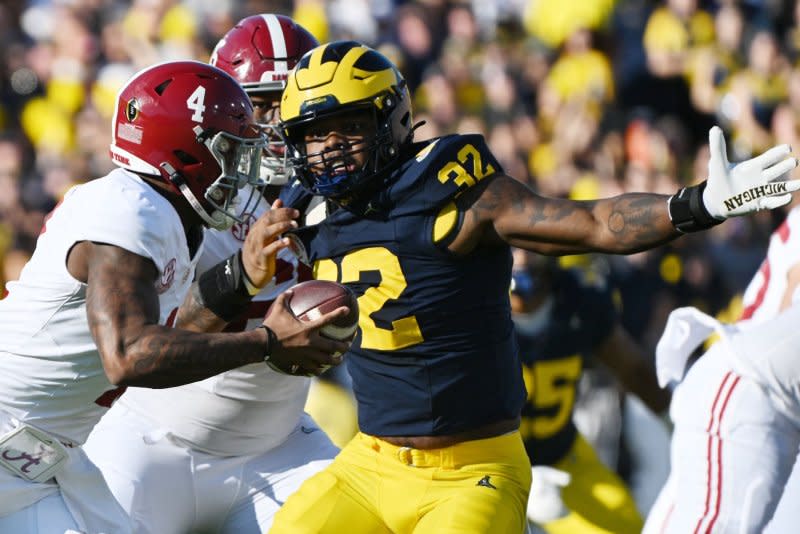 Michigan Wolverines defensive end Jaylen Harrell (R) pressures Alabama Crimson Tide quarterback Jalen Milroe in the first quarter of the 2024 Rose Bowl Game on Monday at the Rose Bowl in Pasadena, Calif. Photo by Jon SooHoo/UPI