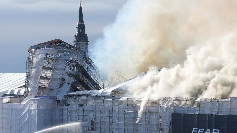 Smoke rises out of the Old Stock Exchange in Copenhagen