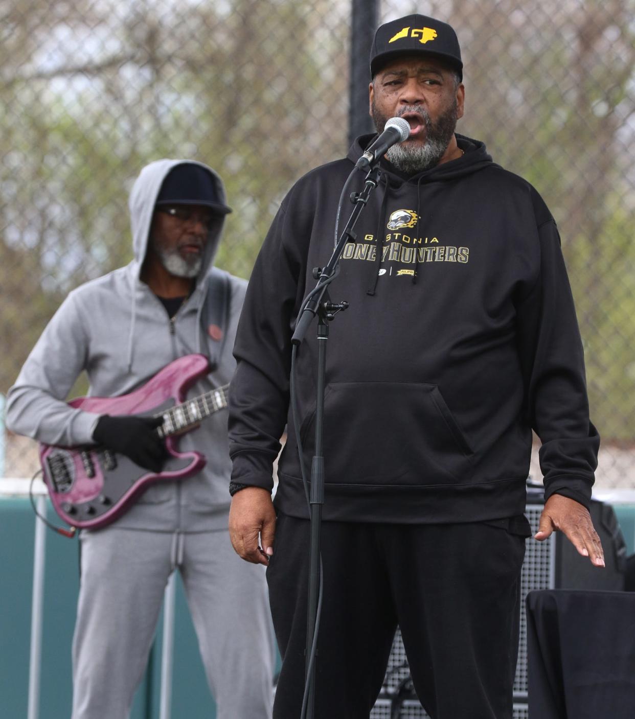 Gastonia Mayor Walker Reid sings with “Image” during the Honey Hunters Community Day held Saturday, April 9, 2022.