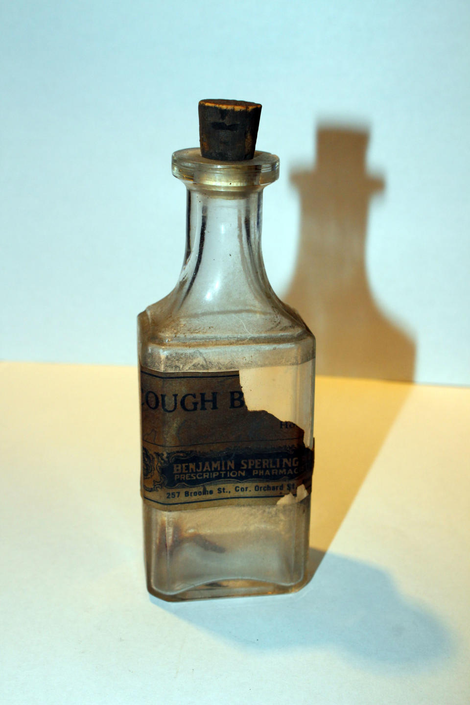 <p>This cough medicine bottle, from 257 Broome St. at the corner of Orchard St., was found in apartment in 1993. (Photo: Caters News) </p>