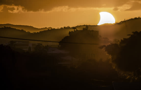 Astrophotographer CJ Armitage of Brisbane, Australia, caught the partial solar eclipse at sunset on April 29, 2014.