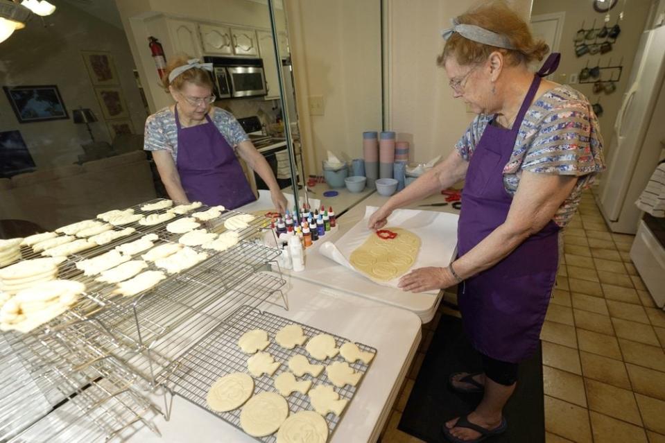 Julie Muller, who sells cookie decorating kits on Etsy, makes cutout cookies for her Black Lives Matter kits Tuesday, Sept. 22, 2020, in Houston. (AP Photo/David J. Phillip)