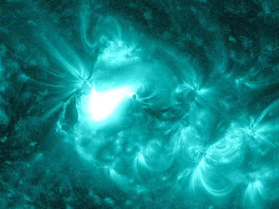 The Solar Dynamics Observatory captured this image of an M1.2 class flare on June 13, 2012. The sun is shown here in teal as this is the color typically used to represent light in the 131 Angstrom wavelength, a wavelength particularly good for