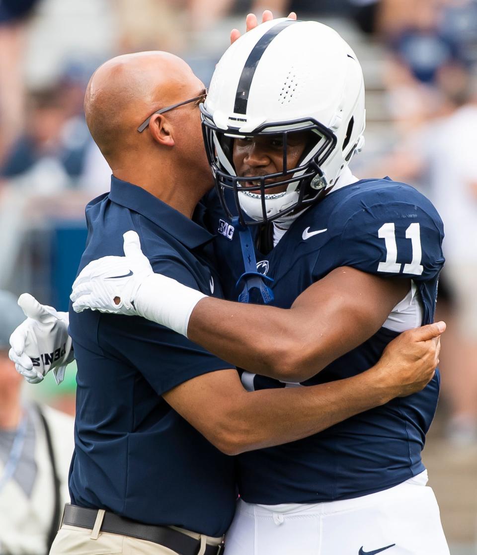 Penn State outside linebacker Abdul Carter (11) greets head football coach James Franklin before the start of a NCAA football game against Delaware Saturday, Sept. 9, 2023, in State College, Pa.