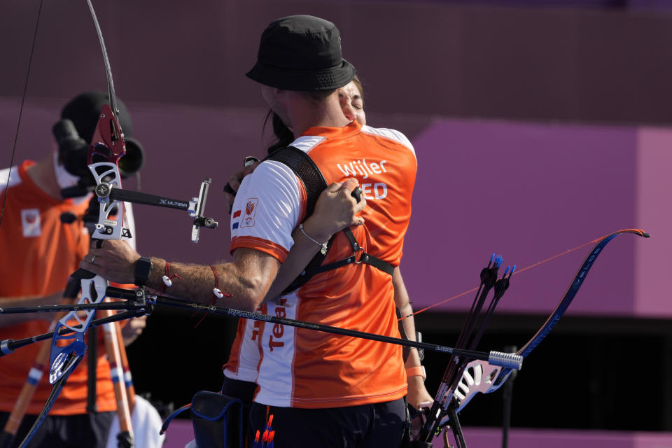 Second placed Gabriela Schloesser and Steve Wijler of the Netherlands celebrate at the end the mixed team semifinal against Turkey at the 2020 Summer Olympics, Saturday, July 24, 2021, in Tokyo, Japan. (AP Photo/Alessandra Tarantino)