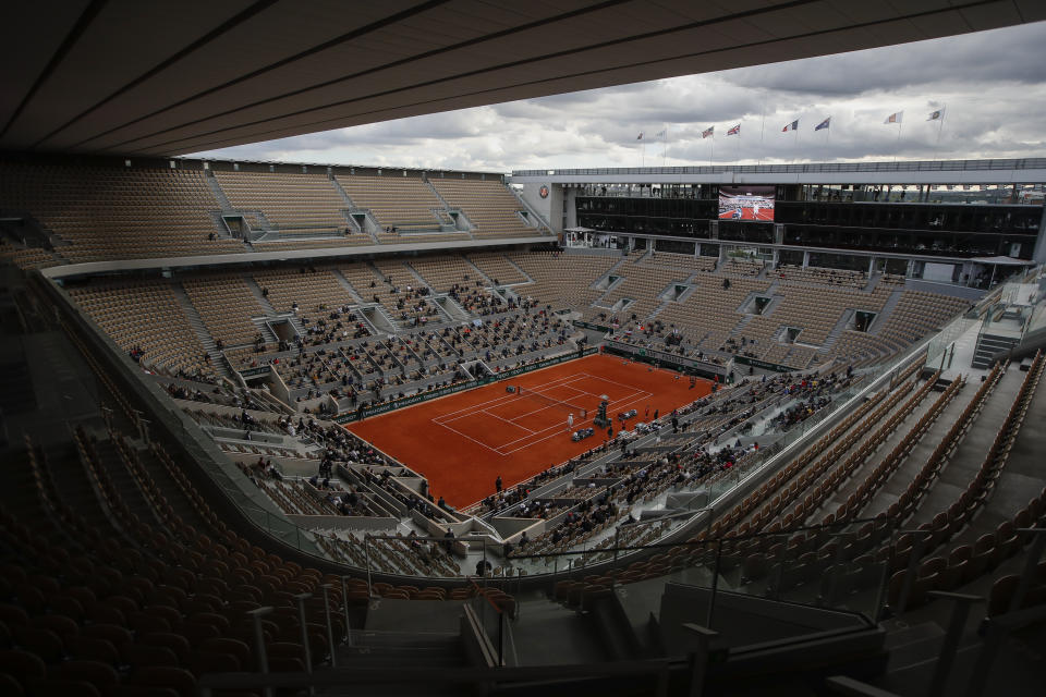 FILE - This is a view of the center court where Poland's Iga Swiatek waits for Sofia Kenin of the U.S. to return from medical treatment during the women's singles final match of the French Open tennis tournament at Roland Garros stadium in Paris, France, in this Saturday, Oct. 10, 2020, file photo. The AP has put together a quiz for you to test your knowledge before the clay-court major championship begins Sunday. (AP Photo/Alessandra Tarantino, File)