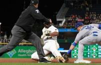 Jun 6, 2018; Pittsburgh, PA, USA; Los Angeles Dodgers third baseman Justin Turner (10) tags Pittsburgh Pirates pinch hitter Gregory Polanco (25) out at third base attempting to stretch a double during the sixth inning at PNC Park. Mandatory Credit: Charles LeClaire-USA TODAY Sports