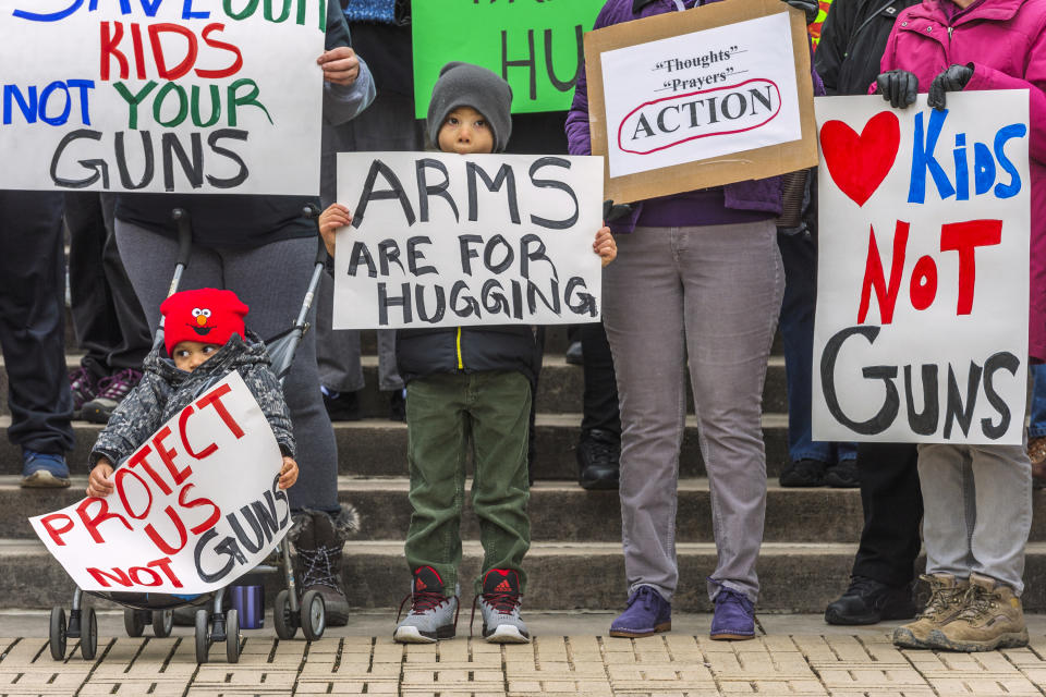 <p>Kanawha City Elementary school student Derrick Johnson, 5, and his brother David Johnson, 3 stand with others gathered on the steps of the Capitol building in Charleston, W.V.. (Craig Hudson/Charleston Gazette-Mail via AP) </p>