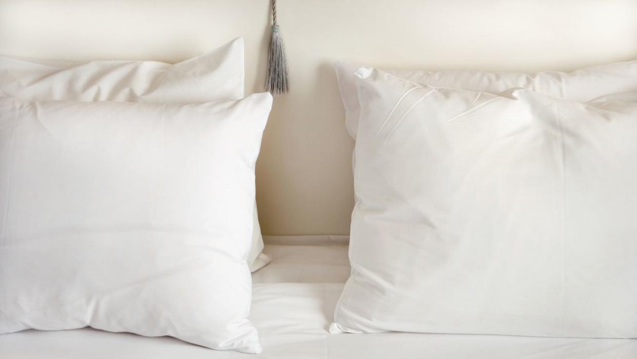 white pillows on bed