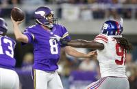 Oct 3, 2016; Minneapolis, MN, USA; Minnesota Vikings quarterback Sam Bradford (8) passes under the pressure of New York Giants linebacker Kelvin Sheppard (91) in the third quarter at U.S. Bank Stadium. Mandatory Credit: Bruce Kluckhohn-USA TODAY Sports