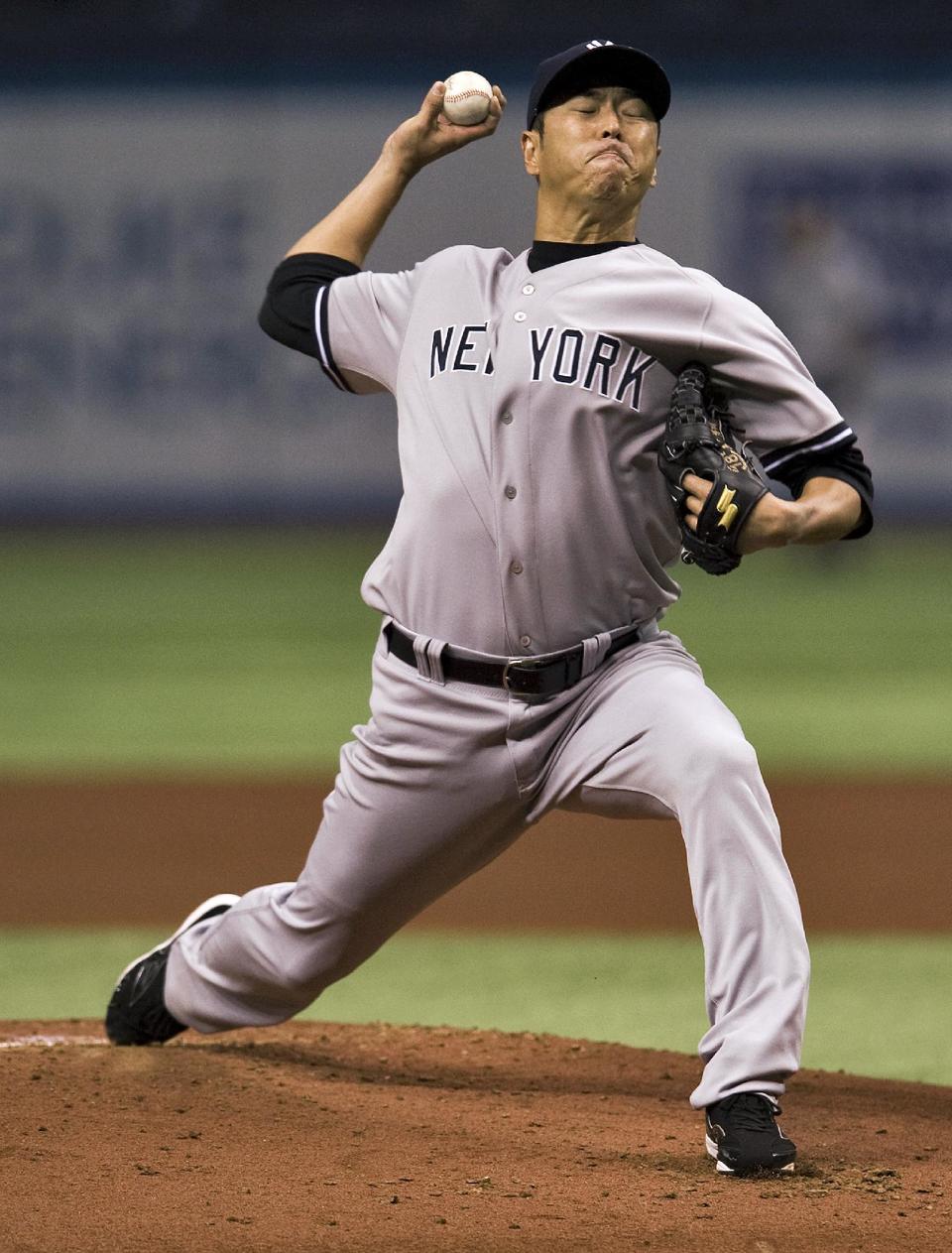 New York Yankees starter Hiroki Kuroda pitches against the Tampa Bay Rays during the first inning of a baseball game Friday, April 18, 2014, in St. Petersburg, Fla. (AP Photo/Steve Nesius)