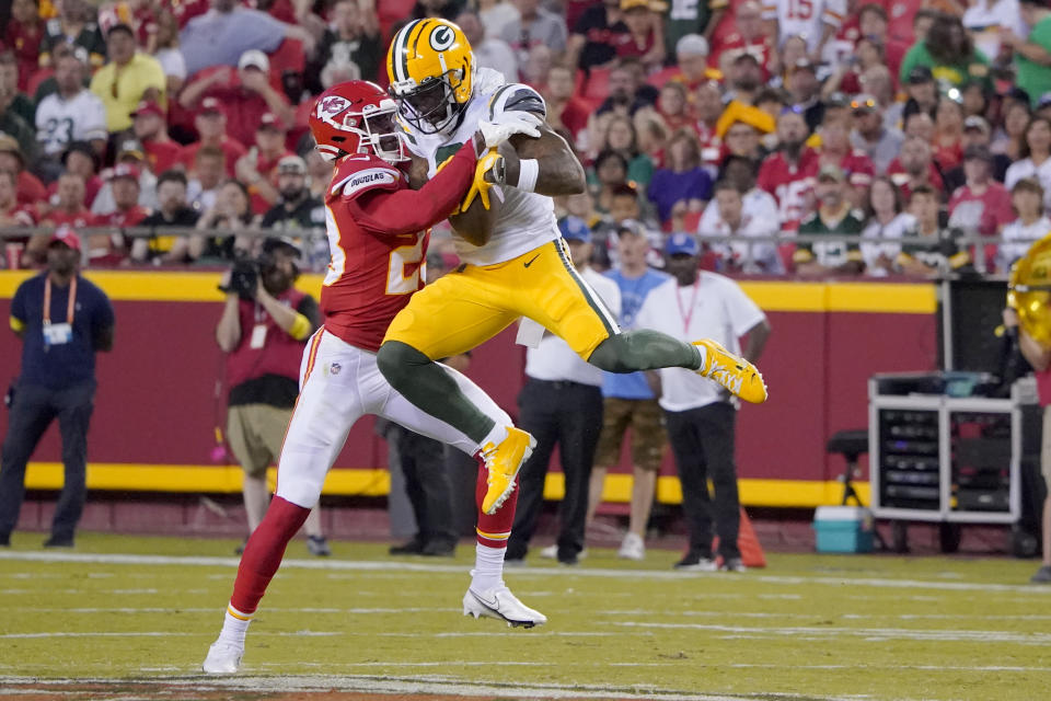 Green Bay Packers wide receiver Amari Rodgers catches a pass as Kansas City Chiefs cornerback Joshua Williams, left, defends during the first half of an NFL preseason football game Thursday, Aug. 25, 2022, in Kansas City, Mo. (AP Photo/Ed Zurga)