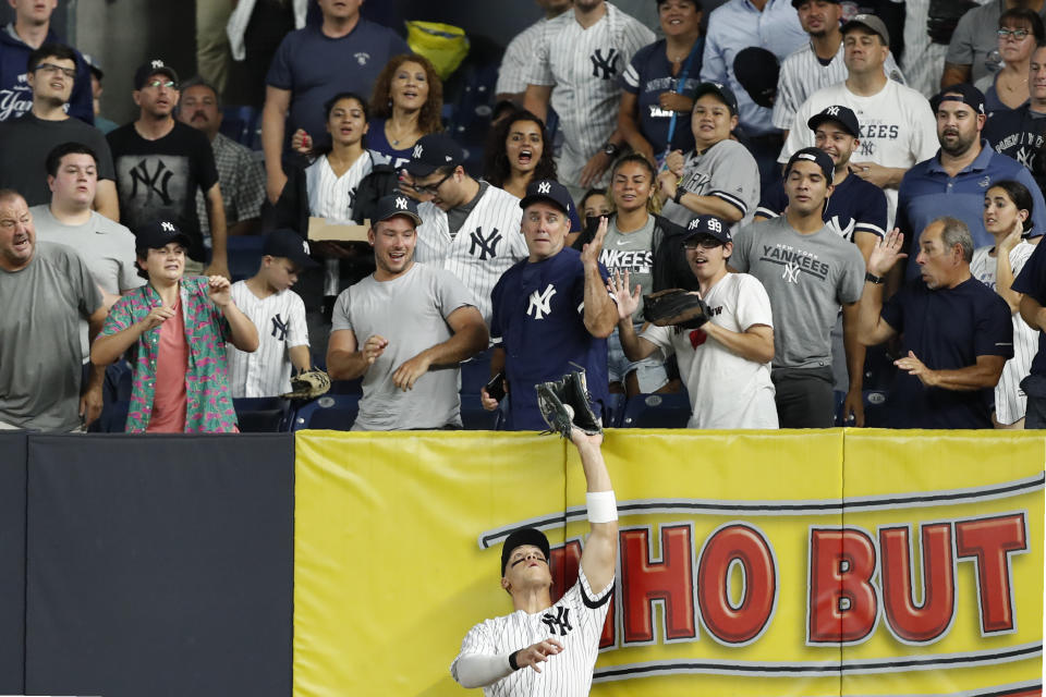 New York Yankees' right fielder Aaron Judge reaches up and catches a fly ball by Tampa Bay Rays' Austin Meadows during the fifth inning of the second game of a baseball doubleheader, Thursday, July 18, 2019, in New York. (AP Photo/Kathy Willens)