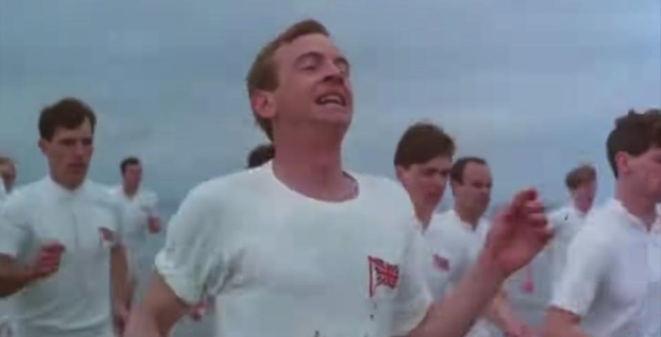 Men wearing white run across a beach in "Chariots of Fire"