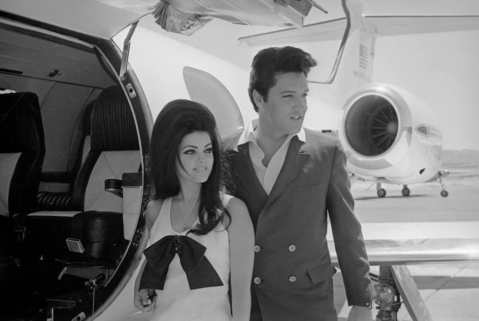 Elvis and Priscilla Presley Posing near Airplane (Bettmann Archive)