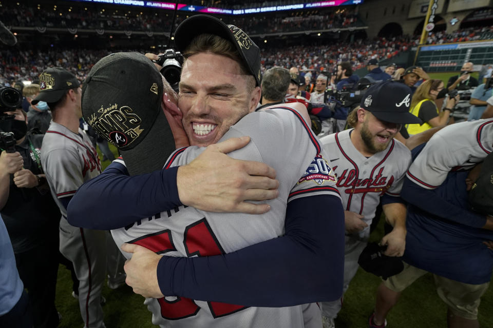 Atlanta Braves relief pitcher Will Smith and first baseman Freddie Freeman celebrate after winning baseball's World Series in Game 6 against the Houston Astros Tuesday, Nov. 2, 2021, in Houston. The Braves won 7-0. (AP Photo/Eric Gay)