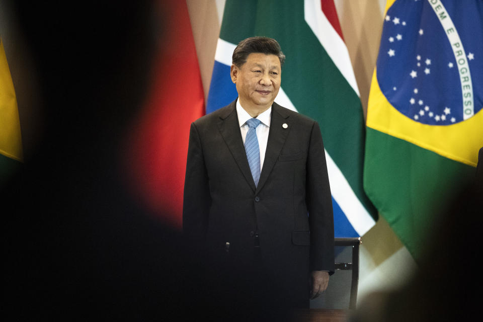 China's President Xi Jinping arrives for a meeting with members of the Business Council and management of the New Development Bank during the BRICS emerging economies at the Itamaraty palace in Brasilia, Brazil, Thursday, Nov. 14, 2019. (AP Photo/Pavel Golovkin, Pool)