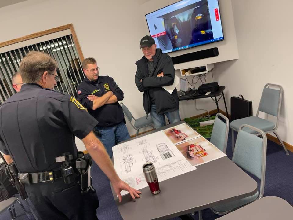Public Safety Director Kurt Etter, Assistant Fire Chief Rick Riggs and Councilman Andy Penrose review capabilities of the Fouts 4 Initial Attack Fire Apparatus.